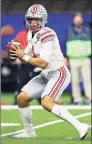  ?? Kevin C. Cox / Getty Images ?? Ohio State’s Justin Fields passes against Clemson in the first half during the College Football Playoff semifinal game at the Allstate Sugar Bowl at Mercedes-Benz Superdome on Friday in New Orleans.