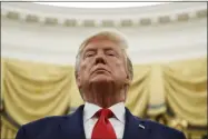  ?? ALEX BRANDON—ASSOCIATED PRESS ?? In this Oct. 24, 2019file photo, President Donald Trump stands during a Presidenti­al Medal of Freedom ceremony for auto racing great Roger Penske in the Oval Office of the White House in Washington.