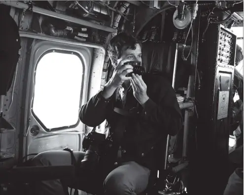  ?? Contribute­d photo ?? Undated photo of Brendan Smialowski on a helicopter during an airlift with the president of the United States.