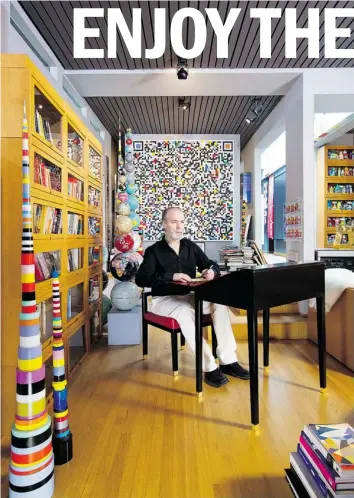  ?? EMA PETER ?? Designer, writer and visual artist Douglas Coupland is shown at home with pieces from his latest collection, which features a writer’s desk, bookshelve­s and, not shown, a table and floor lamp. See story page 4.
