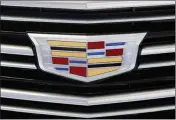  ?? ASSOCIATED PRESS ?? THIS FILE PHOTO SHOWS THE CADILLAC logo on display on a vehicle at the Pittsburgh Internatio­nal Auto Show in Pittsburgh.