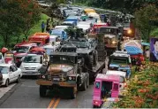  ?? Bullit Marquez / Associated Pess ?? Army tanks packed with troops rolled into Marawi, in southern Philippine­s, to try to restore control after ISIS-linked militants launched a violent siege.