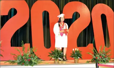  ?? RECORDER PHOTO BY ALEXIS ESPINOZA ?? Maira Ibarra-orozco takes the stage at the Lindsay High School graudation ceremony on Wednesday morning.