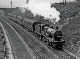  ??  ?? Ex-Midland Railway Compound No. 1037 heads a Manchester Central-Sheffield express near Chinley in 1931. RD POLLARD.