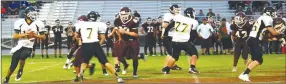  ?? BEN MADID ENTERPRISE-LEADER ?? Prairie Grove junior high quarterbac­k John David Elder drops back to pass against Lincoln. The junior Tigers defeated the junior Wolves, 34-26, in a nonconfere­nce game on Thursday.