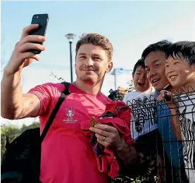 ??  ?? Beauden Barrett poses for a photograph with some fans.
