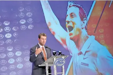  ?? AP PHOTOS/CHUCK BURTON ?? Clemson football coach Dabo Swinney speaks Wednesday during the first day of the ACC Media Days in Charlotte, N.C.