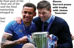  ??  ?? Steven Gerrard poses with trophy with James Tavernier