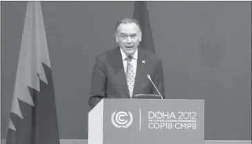  ?? Getty Images ?? Environmen­t Minister Peter Kent addresses delegates at the UN climate talks in Doha earlier this month. Canada has become the first country to officially pull out of the Kyoto Protocol, which aimed to curb greenhouse gas emissions.