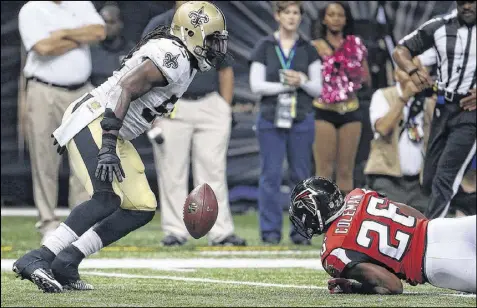  ?? CHRIS GRAYTHEN / GETTY IMAGES ?? Tevin Coleman’s impressive run against New Orleans ended in misfortune when he took a hit and fumbled at the 9-yard line. Still, the Falcons don’t seem to have lost confidence in the third-round draft choice.