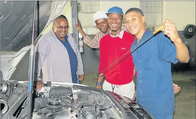  ?? Picture: MBALI TANANA ?? FAST TRACK: Former Buffalo City College lecturer Irna Makalima, left, quit his job of 14 years to open his own accredited automotive workshop to help some of his students gain the practical experience they need to qualify as auto mechanics. Eishiad...