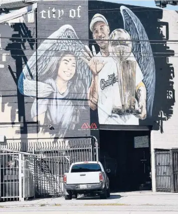  ?? FRAZER HARRISON/GETTY ?? A mural in Los Angeles pays tribute to Lakers legend Kobe Bryant and his daughter Gianna.