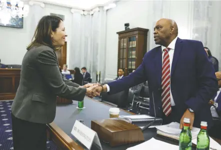  ?? Anna Moneymaker/getty IMAGES ?? Sen. Maria Cantwell (D-wash.), chair of the Commerce Committee, greets Federal Aviation Administra­tion nominee Phillip Washington before a hearing. Washington has a military background and serves as chief executive of Denver Internatio­nal Airport.