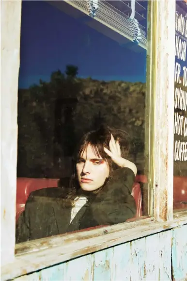  ??  ?? Hari Nef wears blazer, Burberry; vintage blouse, Silk & Rope. Photograph­er: Kendall Jenner. Fashion editor: Panos Yiapanis. Creative director: Katie Grand