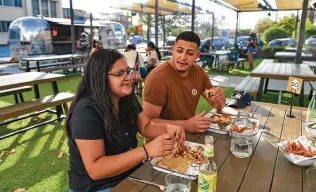  ?? Billy Calzada / Staff file photo ?? Camp Outpost Co.: With lots of tables and a bar in an Airstream trailer, eating here is relaxed.