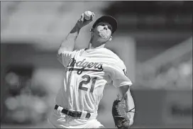  ?? [AP PHOTO] ?? Los Angeles Dodgers starting pitcher Walker Buehler throws against the Colorado Rockies during the first inning of a tiebreaker baseball game, Monday in Los Angeles.