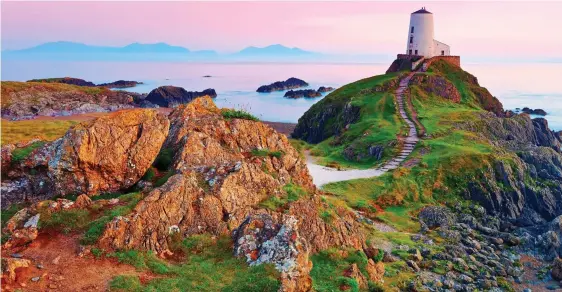  ?? ?? WILD IDYLL: Craggy Llanddwyn Island and Twr Mawr lighthouse