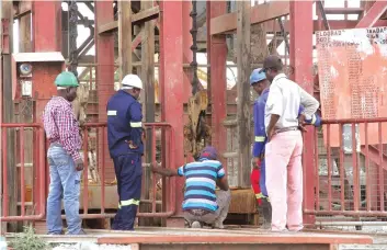  ??  ?? Eldorado mine employees inspect the mine shaft