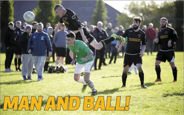  ?? Photo: Barbara Flynn ?? Avonmore’s Paddy Kennedy clears this ball at the expense of Newtown’s Brandon Feehily during the Wicklow Cup clash last weekend.