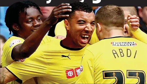  ?? GETTY IMAGES ?? Happy Hornets: Troy Deeney (centre) has fired Watford to promotion in an incredibly tight Championsh­ip title race