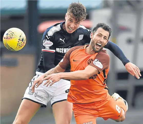  ?? Picture: SNS Group. ?? Dundee’s Jack Hendry and Scott McDonald of United battle it out in last month’s Dens clash in the group stage.