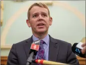  ?? MARK MITCHELL — NEW ZEALAND HERALD VIA AP ?? New Zealand Police Minister Chris Hipkins at a news conference in Wellington, New Zealand, on Thursday where New Zealand's government declared the Proud Boys and The Base terrorist organizati­ons.