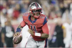  ?? AP file photos ?? Houston Roughnecks quarterbac­k P.J. Walker looks to pass during an XFL game Feb. 8.