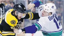  ??  ?? The Bruins’ Kevan Miller, left, and Derek Dorsett tangle during a game in Boston in October.