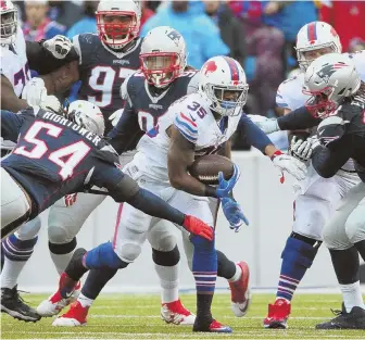  ?? AP PHOTO ?? ON THE RUN: Running back Mike Gillislee finds a hole in the Patriots defense during their game last October in Orchard Park, N.Y.