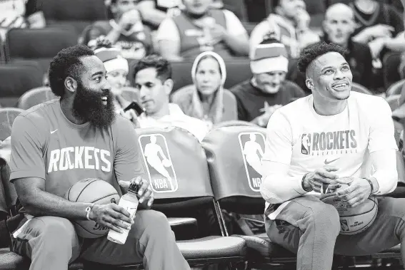  ?? Elizabeth Conley / Staff photograph­er ?? Guards James Harden, left, and Russell Westbrook appear comfortabl­e with the Rockets’ style of play, with Westbrook saying “we’re moving in the right direction.”