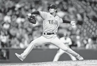  ?? Ron Schwane / Getty Images ?? Jake Latz’s call-up to the major league squad was sudden, but his parents and friends quickly made arrangemen­ts to see his first big-league start for Texas, a 7-2 loss at Cleveland.