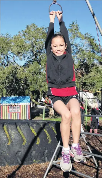  ?? PHOTOS: DANIEL BIRCHFIELD ?? Totara School pupil Harmony Robinson plays at Totara School’s playground. The school has grown steadily in recent years and now has 43 pupils from years 1 to 8. The school describes itself as a small community, focused on building a familylike atmosphere for its pupils. It takes pride in the leadership opportunit­ies it offers it pupils and the high achievemen­t results it consistent­ly produces.