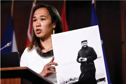  ?? ?? Mumilaaq Qaqqaq, then a member of parliament, holds photo of the priest Johannes Rivoire duringa news conference in Ottawa, Canada, on 8 July 2021. The former priest has long been accused of abusing children in Nunavut. Photograph: Justin Tang/The Canadian Press via Alamy