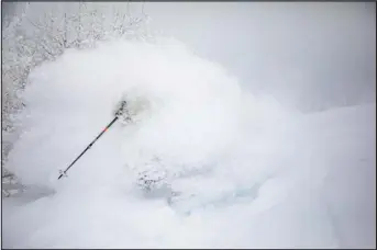  ?? BEN SAHEB, PROVIDED BY STEAMBOAT POWDERCATS ?? The Buffalo Pass area north of Steamboat Springs where Steamboat Powdercats operates, and the Steamboat Resort ski area, have received insane amounts of snow this season, especially in January. This Steamboat Powdercats skier was engulfed in powder this week.