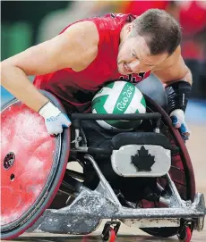  ?? LEAH HENNEL ?? Canada’s Zak Madell, competing in a men’s basketball game against Brazil on Wednesday, is also a star on the Paralympic rugby team.