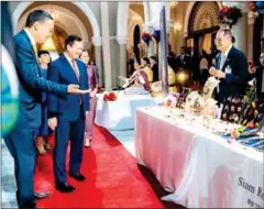  ?? STPM ?? Prime Minister Hun Manet (in red tie) views a showcase of Thai traditiona­l products in Bangkok, Thailand, on February 7.