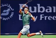  ?? Ahmed Ramzan/Gulf News ?? Denis Istomin powers a forehand shot against Marton Fucsovics during the qualifying round.