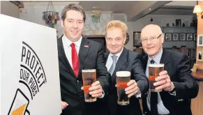  ??  ?? Campaign cheers From left Neil Bibby MSP, Paul Waterson, chief executive of the Licensed Trade Associatio­n and Ray Turpie, public affairs chairman of CAMRA