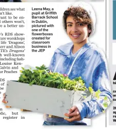  ??  ?? Leena May, a pupil at Griffith Barrack School in Dublin, pictured with one of the flowerboxe­s created for classroom business in the JEP