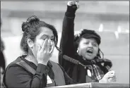  ?? Arkansas Democrat-Gazette/THOMAS METTHE ?? DACA dreamer Diana Pacheco (left) wipes away a tear during her speech as Anika Whitfield (right) cheers her on during the 8th Annual Rally for Reproducti­ve Justice on Saturday at the Arkansas State Capitol in Little Rock.