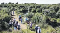  ?? PHOTO: LAURA SMITH ?? Forest trail . . . Southland QEII National Trust Covenant landowners visited Manuka Mire in Mokotua yesterday as part of World Wetland Day.