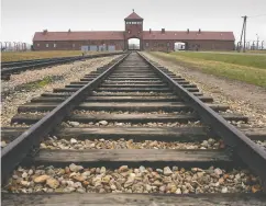  ?? SCOTT BARBOUR / GETTY IMAGES FILES ?? The railway tracks leading to the main gates at
Auschwitz Ii-birkenau in Poland.