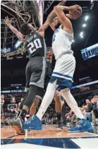  ?? REMPEL/USA TODAY SPORTS BRAD ?? Timberwolv­es center Karl-Anthony Towns steps out of bounds as Kings forward Harry Giles defends.