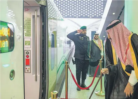  ?? Saudi Press Agency ?? King Salman inaugurate­s Saudi Arabia’s new Haramain high-speed rail service. The trains, below, can carry more than 400 passengers at speeds of up to 300kph, making the journey between Makkah and Madinah a mere two hours