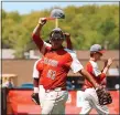  ?? NOELLE WITHERITE — FOR THE NEWSHERALD ?? Mentor’s Hal Walker and teammates celebrate during the Cardinals’ victory over St. Edward on May 15.