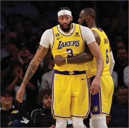  ?? HARRY HOW — GETTY IMAGES ?? Anthony Davis (3) and LeBron James will again carry the heavy load for the Lakers, but it may be a little bit lighter this season.