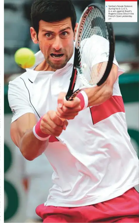  ?? AFP ?? Serbia’s Novak Djokovic during his 6-3, 6-4, 6-4 win against Brazil’s Rogerio Dutra Silva in the French Open yesterday.