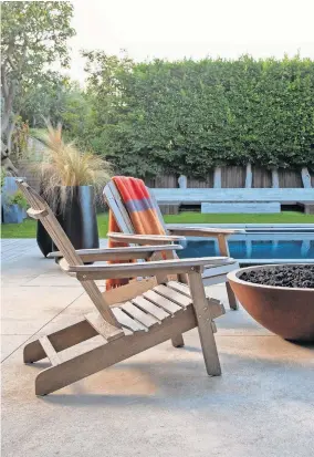  ?? [PHOTO PROVIDED/LIVING SPACES] ?? Since the pandemic has made the outdoors the preferred gathering place, interest in outdoor furnishing­s, like the Adirondack chairs and fire pit pictured, has been on the rise, a new study shows.