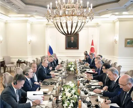  ?? Reuters ?? Delegation­s, led by Russian President Vladimir Putin and Turkish President Tayyip Erdogan, attend a meeting in Ankara on Monday.