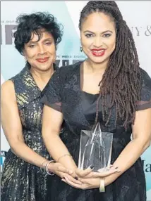  ?? Mark Davis
Getty Images for Women in Film ?? PHYLICIA RASHAD, left, with award winner Ava DuVernay.